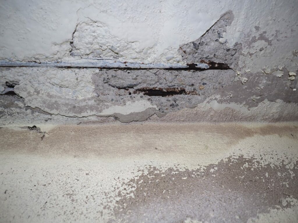 Concrete water damage in a commercial building ceiling